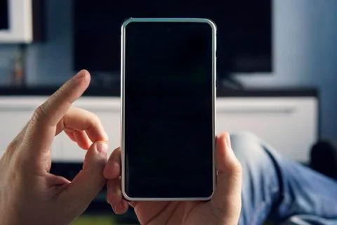 Mockup image blank white screen cell phone.men hand holding texting using mob Stock Photos