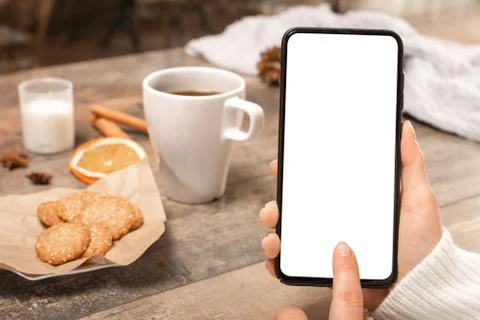 Mockup image blank white screen cell phone. woman hand holding texting using  Foto stock