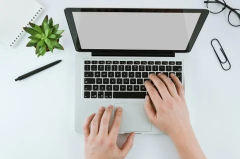 Mockup image computer hand typing with blank screen for text,man using laptop Stock Photos