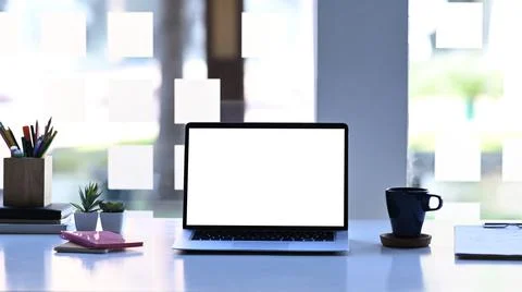 Mockup image of computer laptop, coffee cup, stationery and plant on white ta Stock Photos