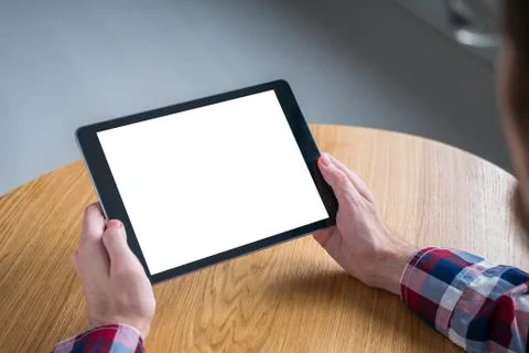 Mockup image of digital tablet computer with white blank screen in man hands Stock Photos