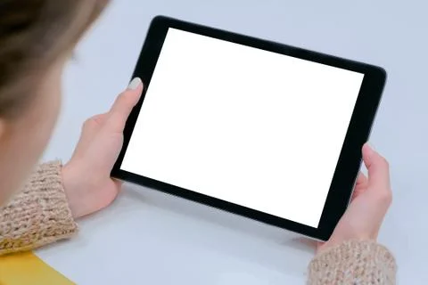 Mockup image of digital tablet computer with white blank screen in woman hands Stock Photos