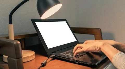 Mockup Image Of Hands Typing On The Keyboard With Blank Laptop Screen Stock Photos