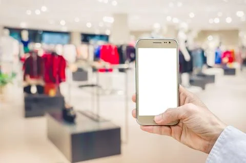 Mockup image of man hand holding gold mobile phone with blank white screen .. Stock Photos