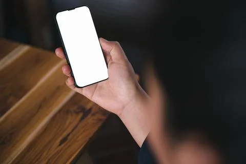 Mockup Image of Woman's Hands is Using Smartphone With Empty White Screen for Stock Photos