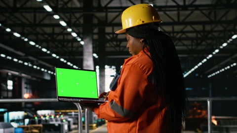 Mockup on laptop, black female engineer, ensuring production line Stock Footage 330139751