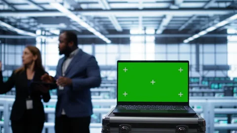 Mockup laptop in data center running error checking software monitoring hardware Stock Footage 277657906
