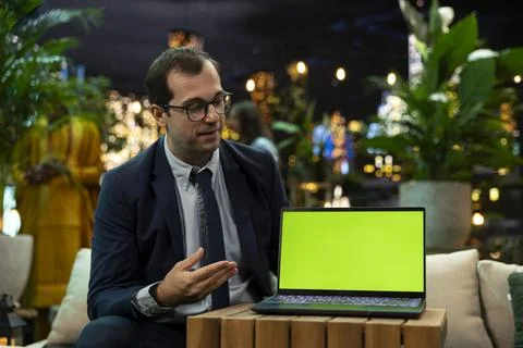 Mockup laptop used by manager explaining his idea to business investors Stockfoto's