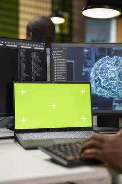 Mockup laptop used by software developer in AI tech company workspace Stock Photos
