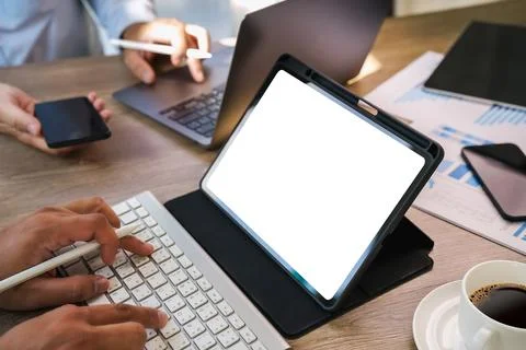 Mockup of a man holds tablet computer with isolated screen  digital tablet .. Stock Photos