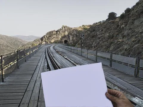 Mockup man looking map in front bridge Stock Photos