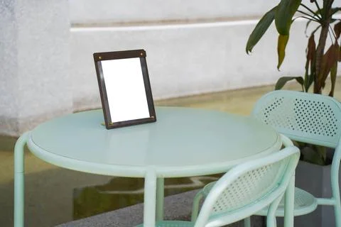 Mockup of a menu frame standing on a table outdoors. Restaurant. Beauty saloo Foto stock