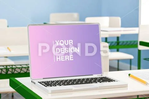 Mockup of modern laptop with black screen placed on desk against classroom PSD Template