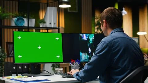 Mockup next to marketing analyst editing smartphone video footage Stock Photos