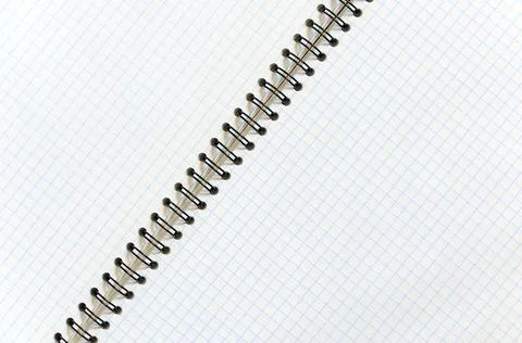 Mockup open checkered notebook with diagonal binding close-up Stock Photos