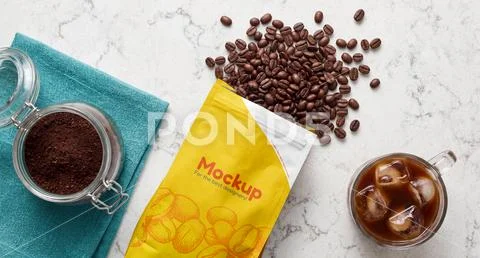 Mockup of a package of coffee beans on a table PSD Template