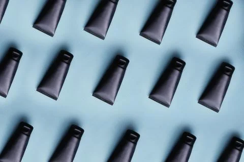 Mockup pattern from blank black plastic cream tube of tooth paste or gel Stock Photos