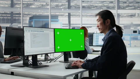 Mockup PC, reviewing microchip production and Asian man in factory workspace Stock Footage 335880511