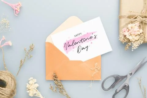 Mockup postcard and envelop on work table with Happy valentines day, DIY gift Stock Photos