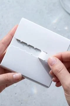 Mockup of a sealed box being opened Stock Photos