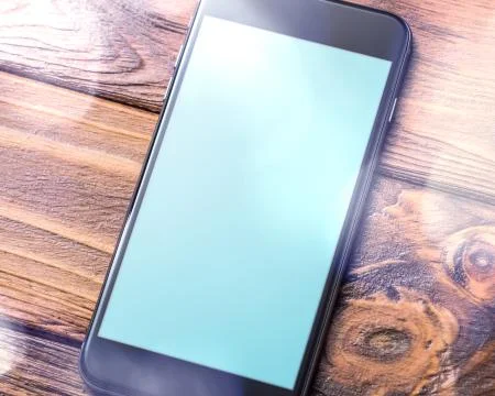 Mockup of smartphone laying on table 写真素材