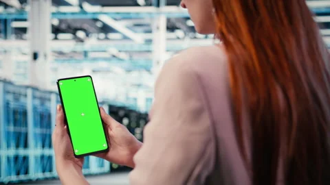 Mockup smartphone used by server room IT expert to optimize rigs Video stock 330205533