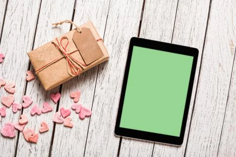 Mockup of tablet pc with gift box 写真素材