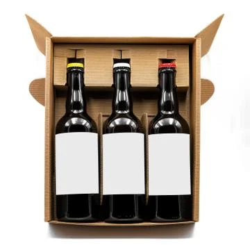 Mockup of three beer bottles inside a cardboard box Stock Photos