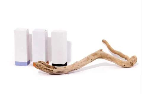  Mockup of three cardboard rectangular boxes for cosmetics. Branch or tree... Stock Photos