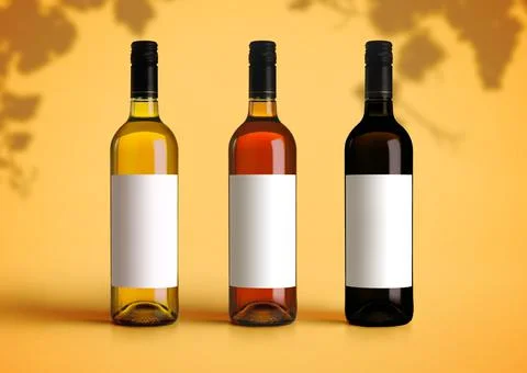 Mockup of three types of wine bottles on a yellow background. Empty blank lab 스톡 사진