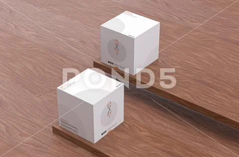 Mockup of two square boxes with thread to close on dark brown wooden backdrop PSD Template