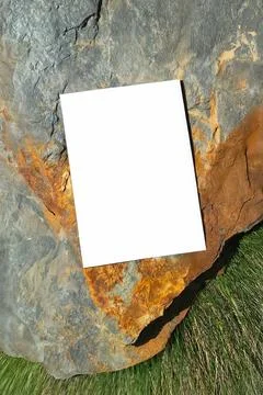 Mockup of white A4 sheet with shadows on large mountain stones Fotos de archivo