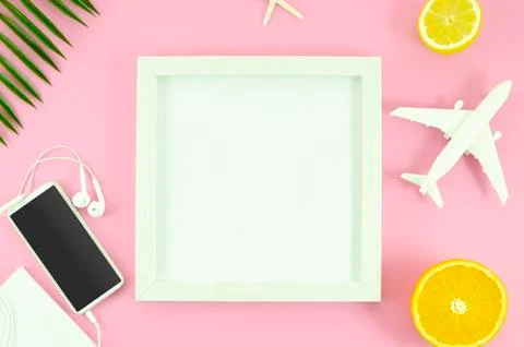 Mockup white frame with copy space. Top view pink table with phone and toy plane Stock Photos