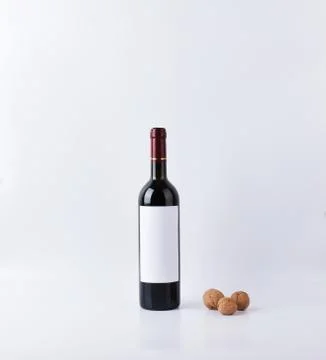 Mockup wine bottle with three nuts isolated Foto stock