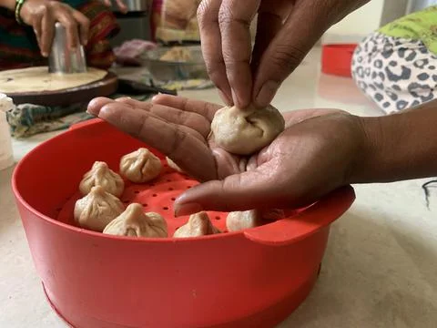 Modak making or preparation. Modak is Maharashtrian sweet dish. Stock Photos