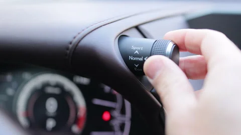 Mode button on luxury car dashboard. Eco mode is a relaxed and comfort sport is Stock Footage 266775572