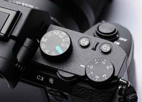 Mode dial, exposure control dial and shutter button on mirrorless camera Stock Photos