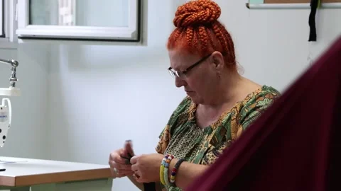 "Mode e Estime", a workshop in France that gives second-hand clothes a new lease Video stock 251719491