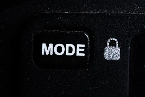 The Mode icon button is close on the camera device. Old and dirty Stock Photos