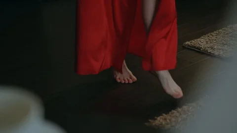 Mode in a red silk robe. Video stock 101552543