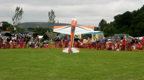 Model aircraft flying demonstration tail landing at Bury agricultural show Stock Footage 41681476