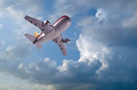Model airplane flying in clouds Stock Photos