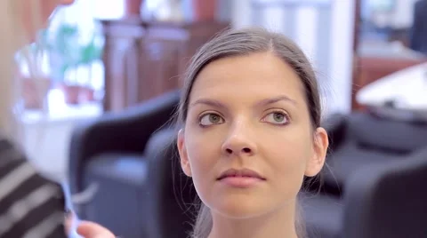 Model and the make-up artist working on eye make-up Stock Footage 68716383