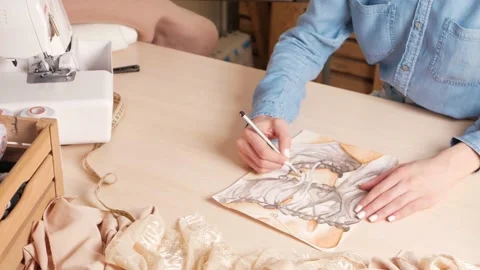 Model and project of future clothes, sketch on paper. Fashionable sewing studio Stock Footage 181439636