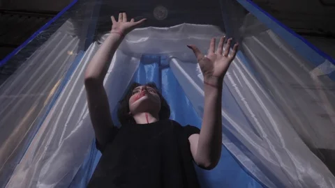 Model with artistic makeup touch transparent capsule side Stock Footage 115237254