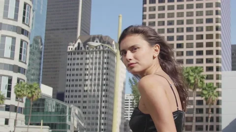 A model on the background of high-rise buildings Stock Footage 154692155