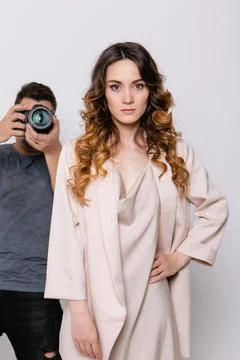 A model with a beautiful makeup in the studio on a white background Photos
