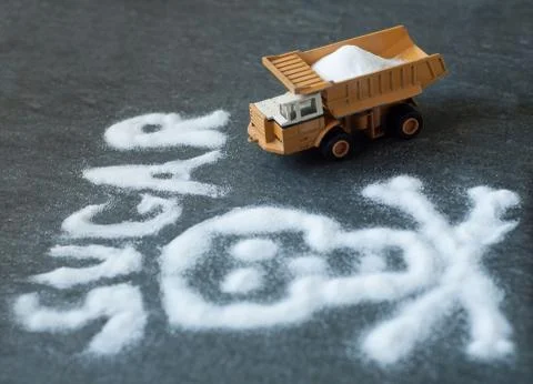 Model of big mining dump-body truck with skull of white sugar Stock Photos