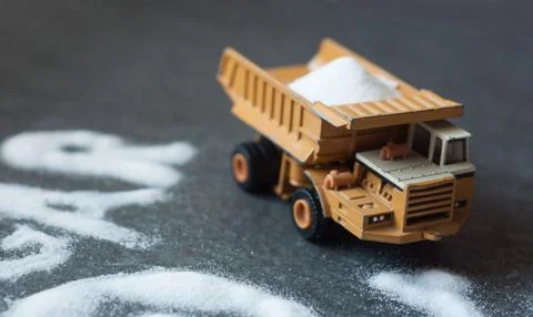 Model of big mining dump-body truck with skull of white sugar 스톡 사진