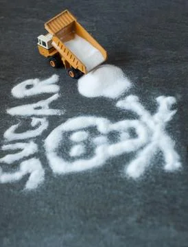 Model of big mining dump-body truck with skull of white sugar Stock Photos